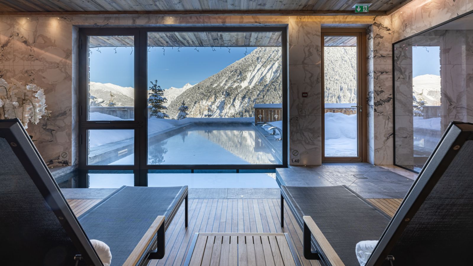 Indoor_Outdoor Heated Pool in Sud Resort, Spa _ Fitness at Ultima Courchevel Belevédère (1).jpg