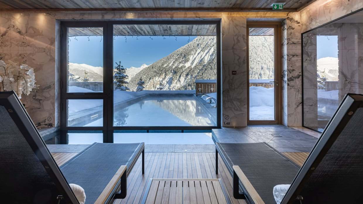 Indoor_Outdoor Heated Pool in Sud Resort, Spa _ Fitness at Ultima Courchevel Belevédère (1).jpg