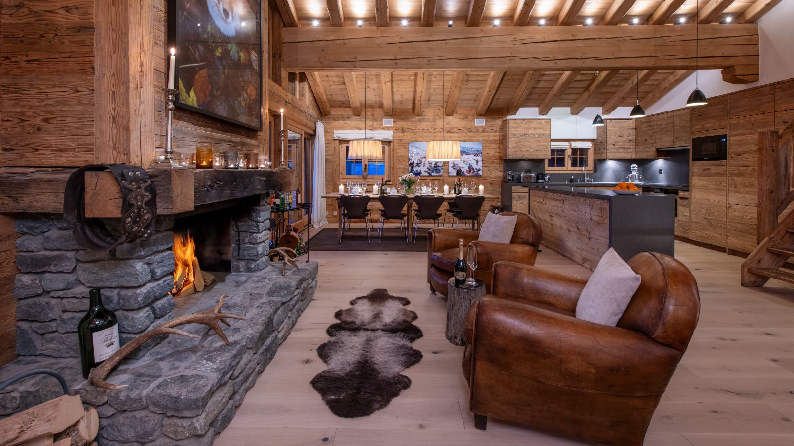 Kitchen and dining room with fireplace in Penthouse Treize Etoiles.jpg