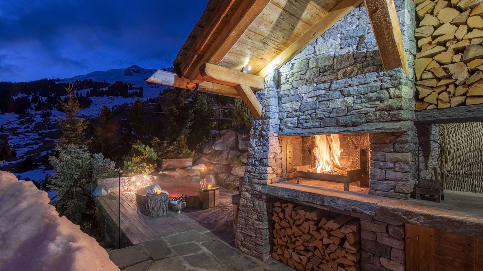 Luxury-ski-chalet- Chalet Belle Claire -oxford-ski outside Fireplace.jpeg