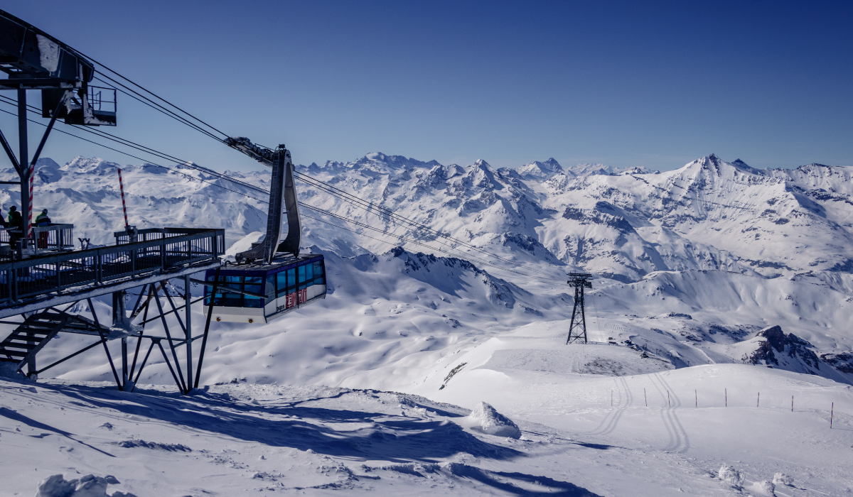 Cable Car infrastructure, looking down the valley. nothing but white peaks covered with snow.